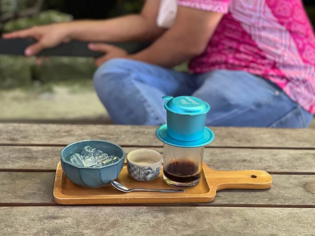 a person sitting at a table with some shoes