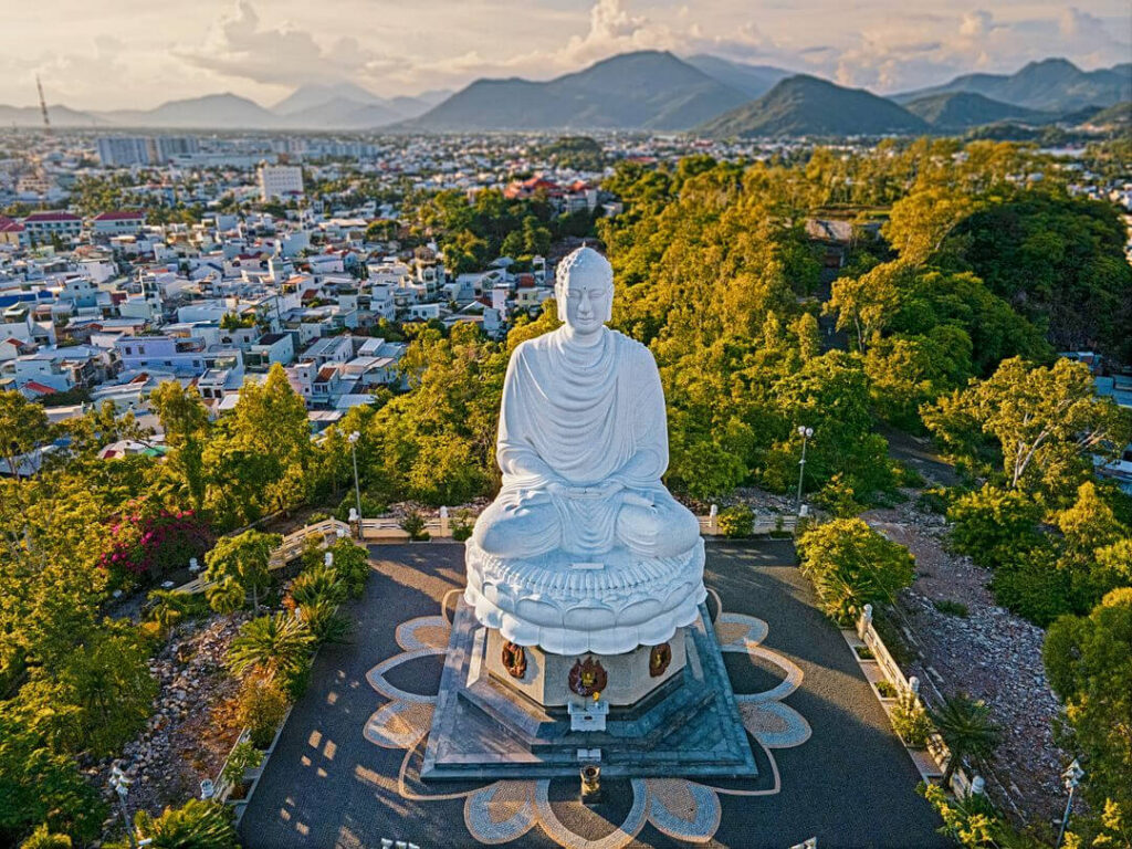 a person standing in front of a mountain