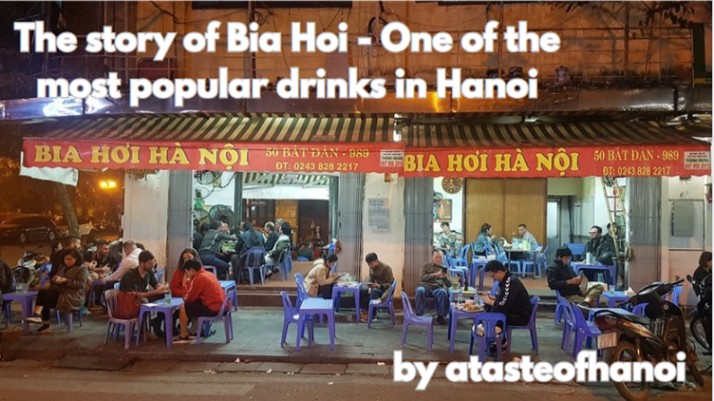 Outdoor bia hoi restaurant in Hanoi with people seated at plastic tables and chairs, illuminated at night.