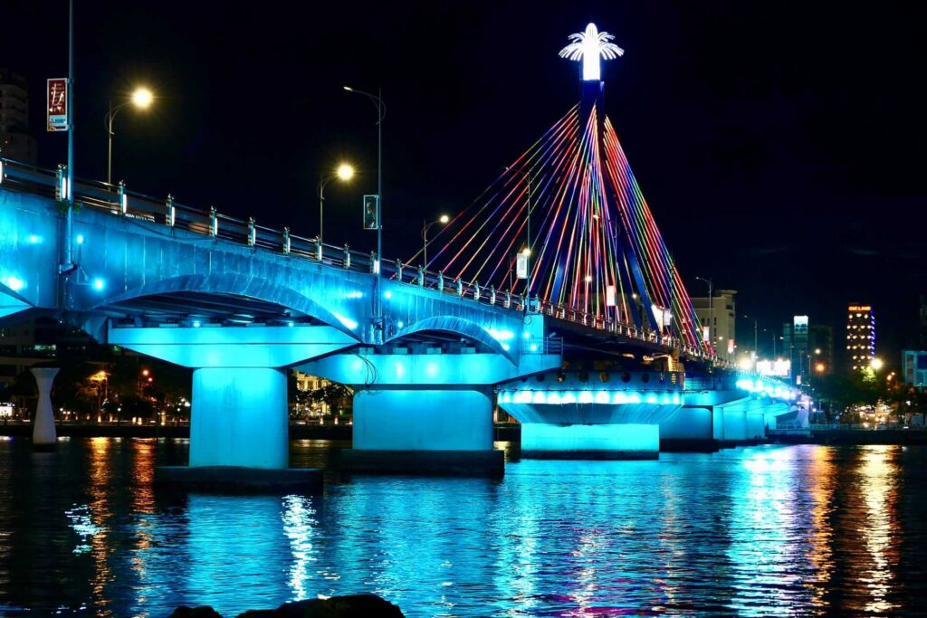 a large bridge lit up at night